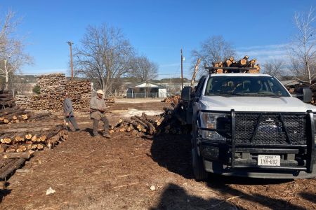 Posts being offloaded and graded for purchase.