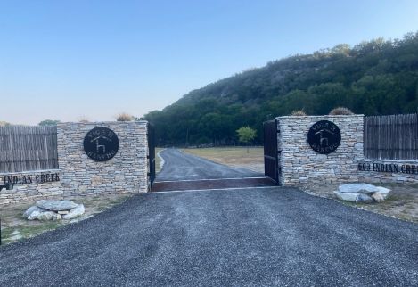 Dry Stacked Rock with Cedar Staves, Cattle Guard, and Custom Gates.